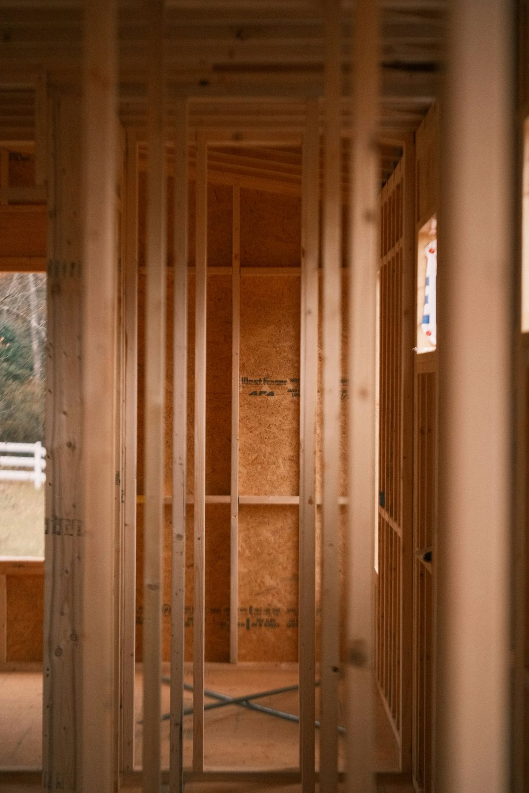 New structural wood framing and beams inside a home under renovation