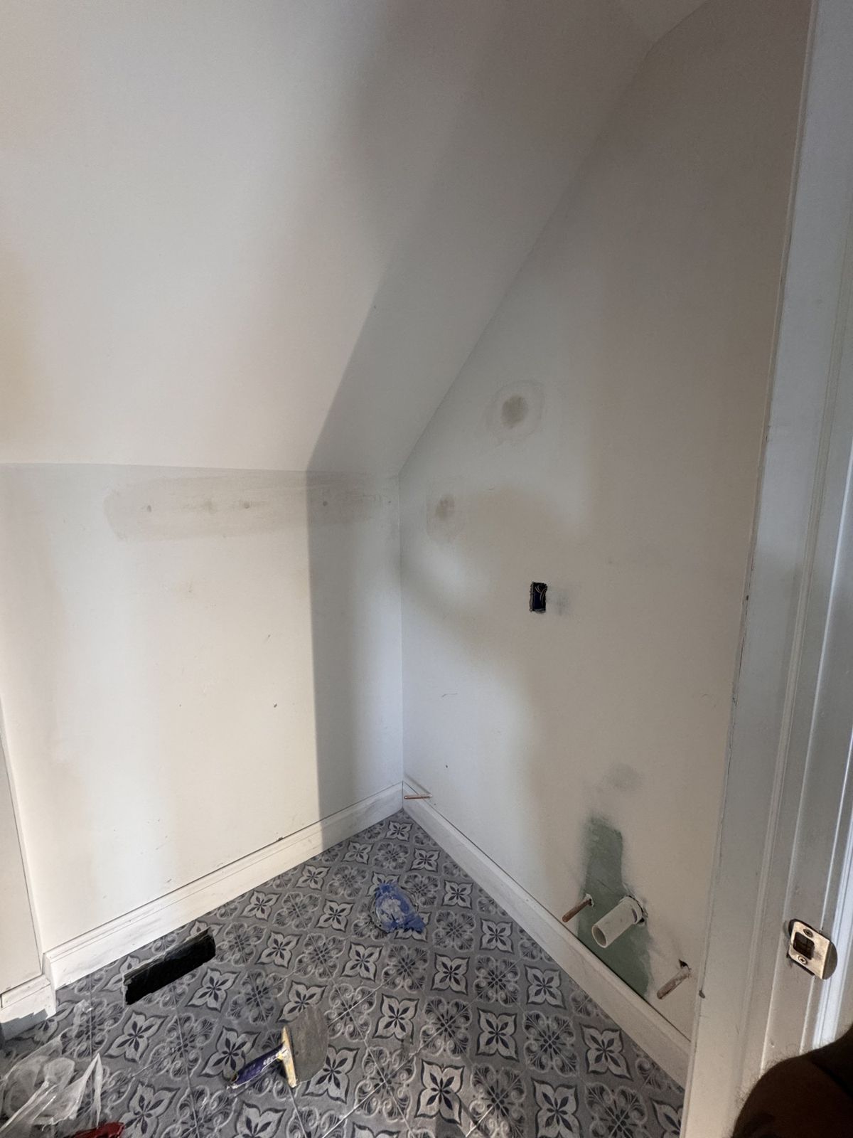 Small room under a sloped ceiling before it became a bathroom